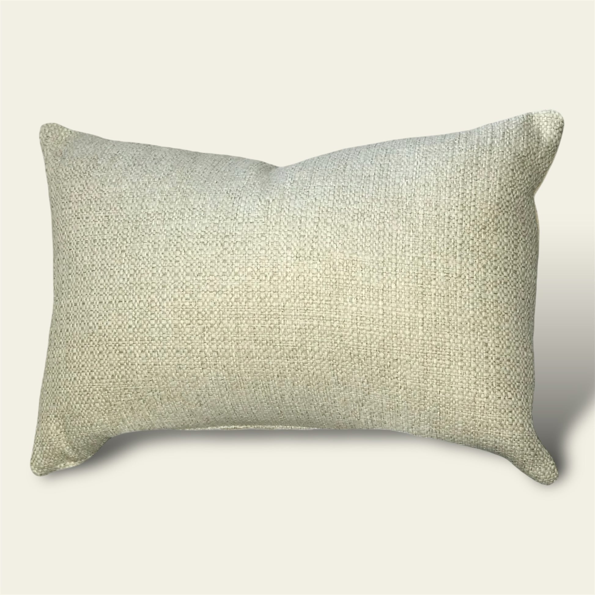 a textured woven cushion cover in a warm oatmeal shade 